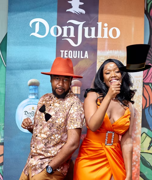 A man and a woman posing festively, representing shared joy and performance.